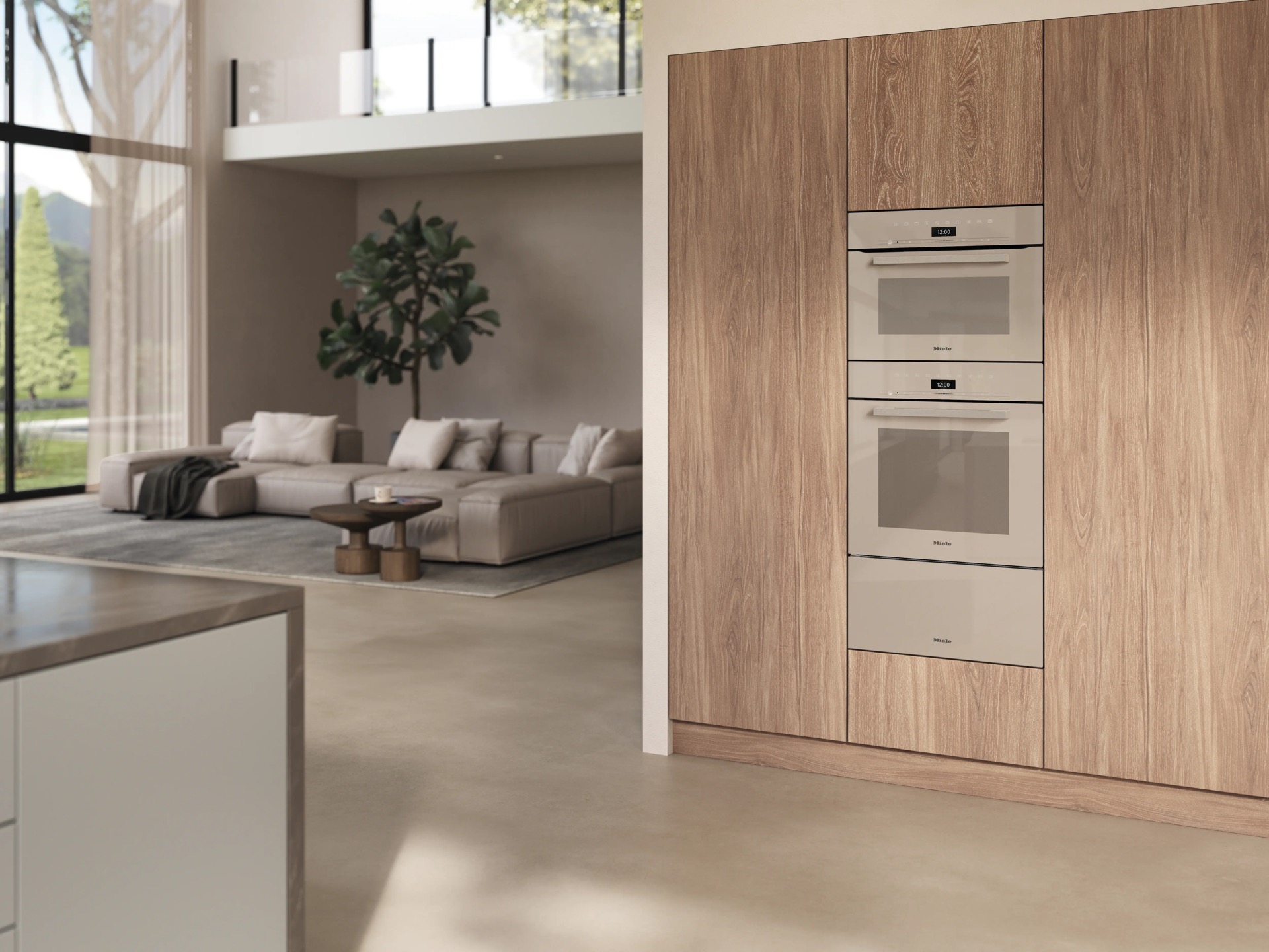 Columna madera con hornos Miele integrados junto zona de estar salón contemporáneo