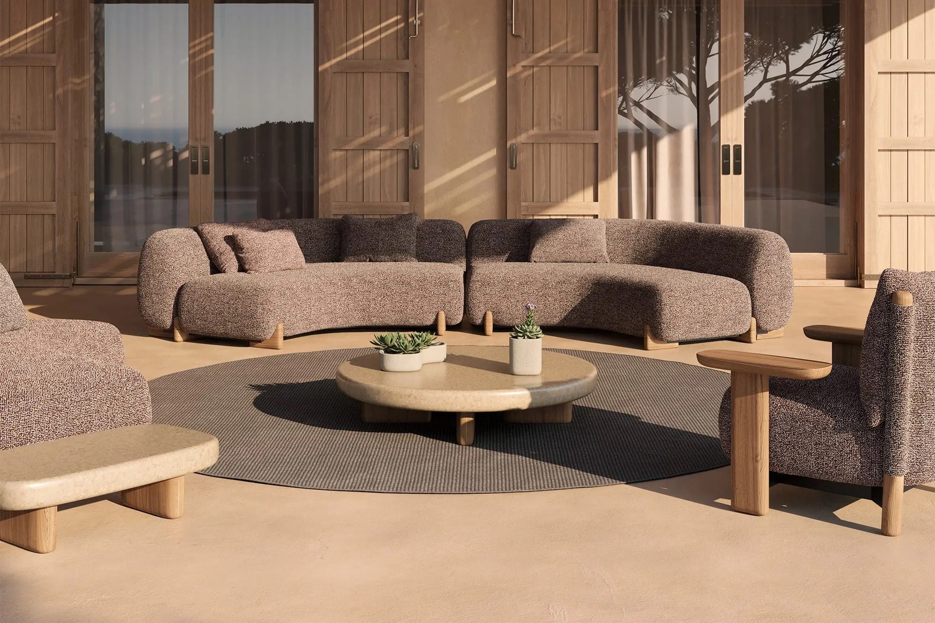 Sofá modular curvo Vondom Milos en terraza con vistas al mar diseño orgánico Jean-Marie Massaud