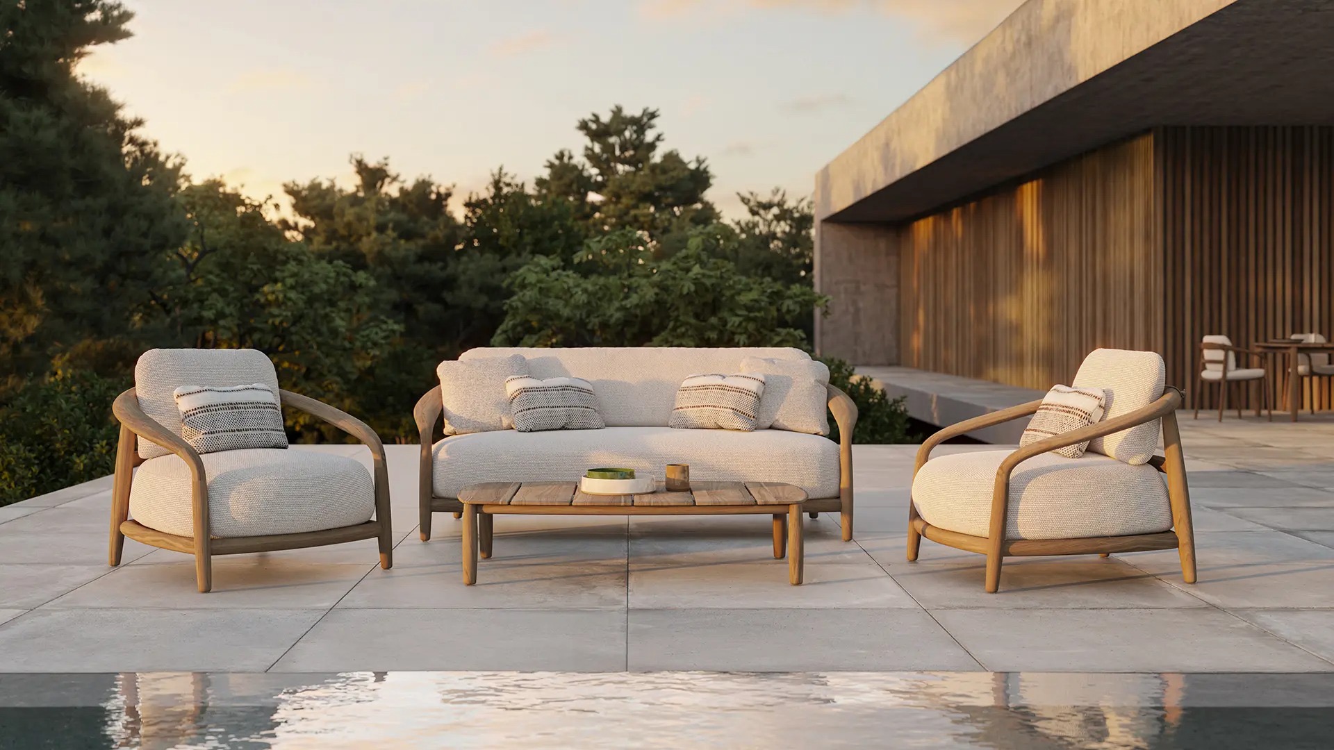 Sofá y sillones Vondom Fusta en madera de teca junto a piscina diseño Ramón Esteve