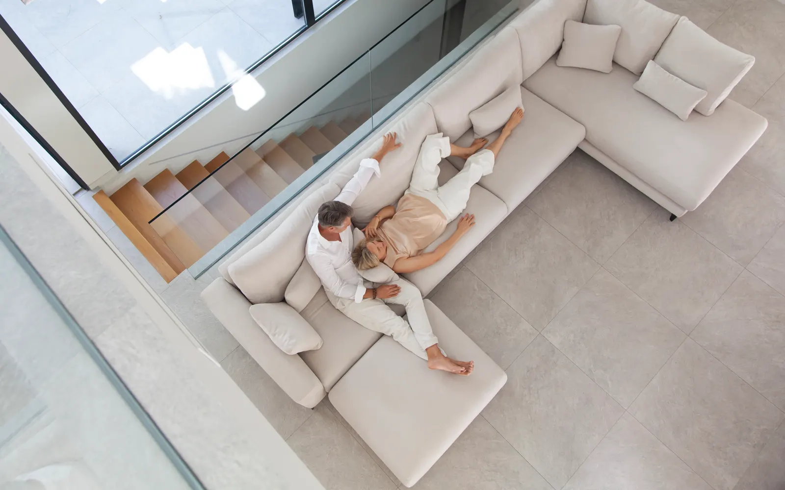 Off-white Fama modular corner sofa seen from above, an L-shaped composition with chaise longue