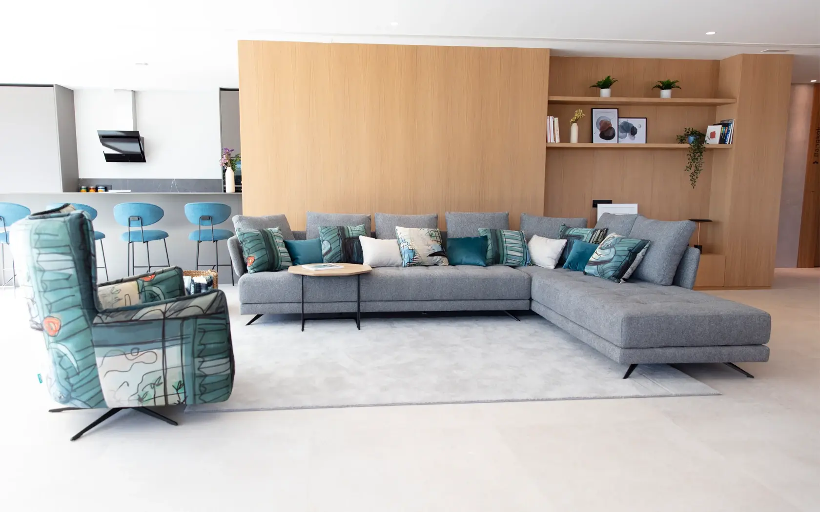 Grey Fama Pacific sofa with chaise longue, metal legs and cushions in turquoise tones